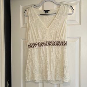 Elegant White Sleeveless Top with Brown Detailing